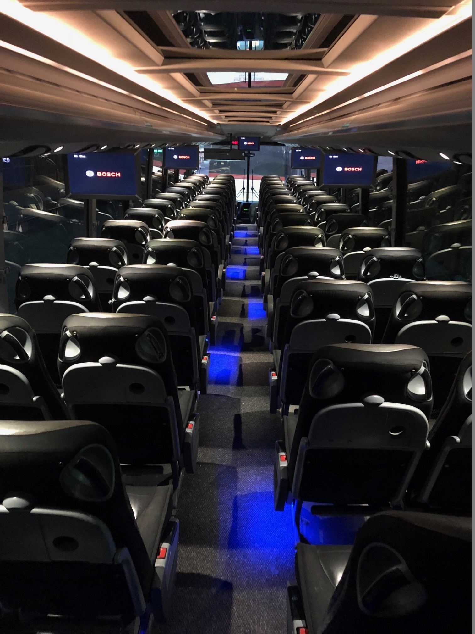 Deluxe motorcoach interior with reclining seats